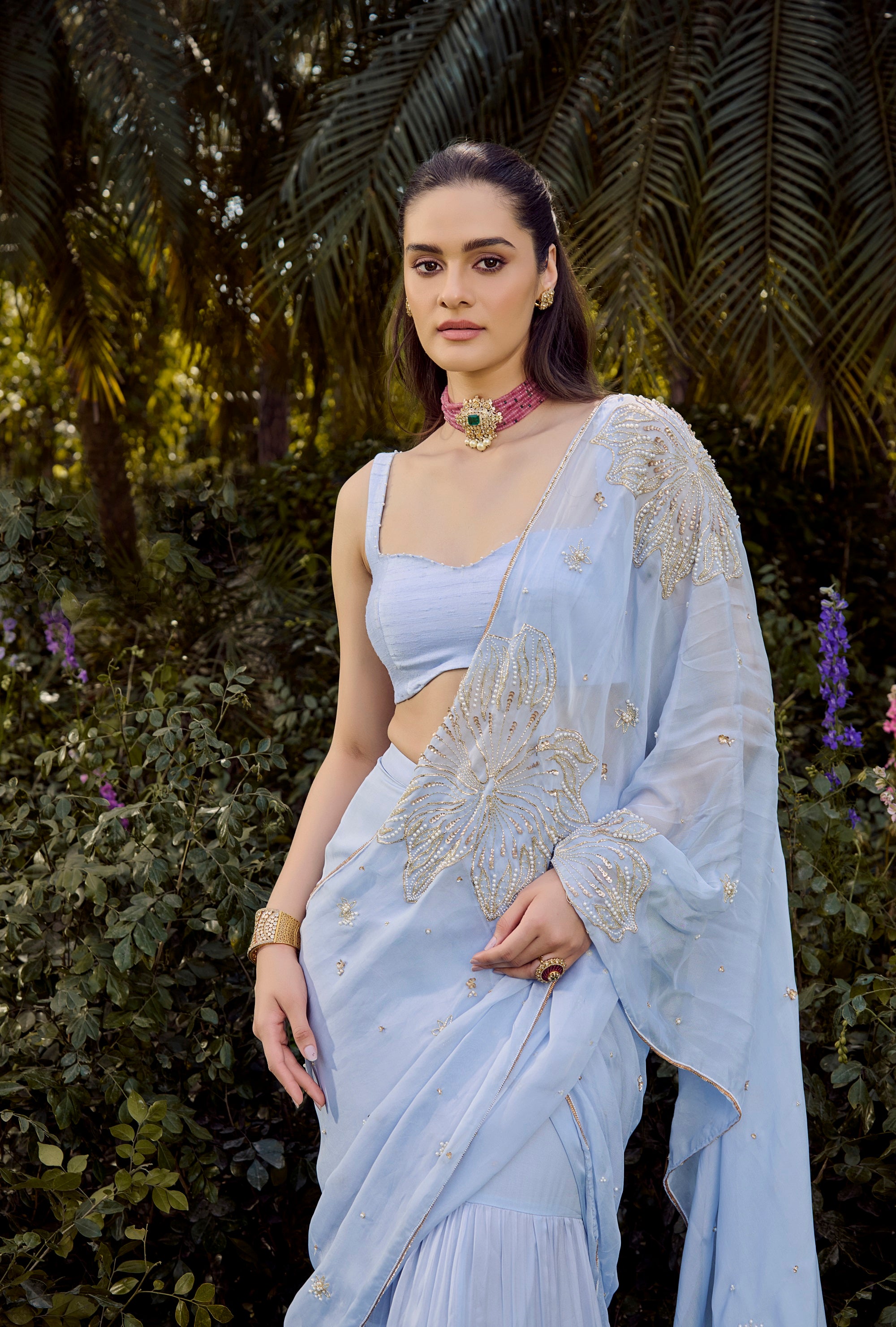 Dew Saree Set - Woman in a light blue saree