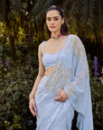 Dew Saree Set - Woman in a light blue saree