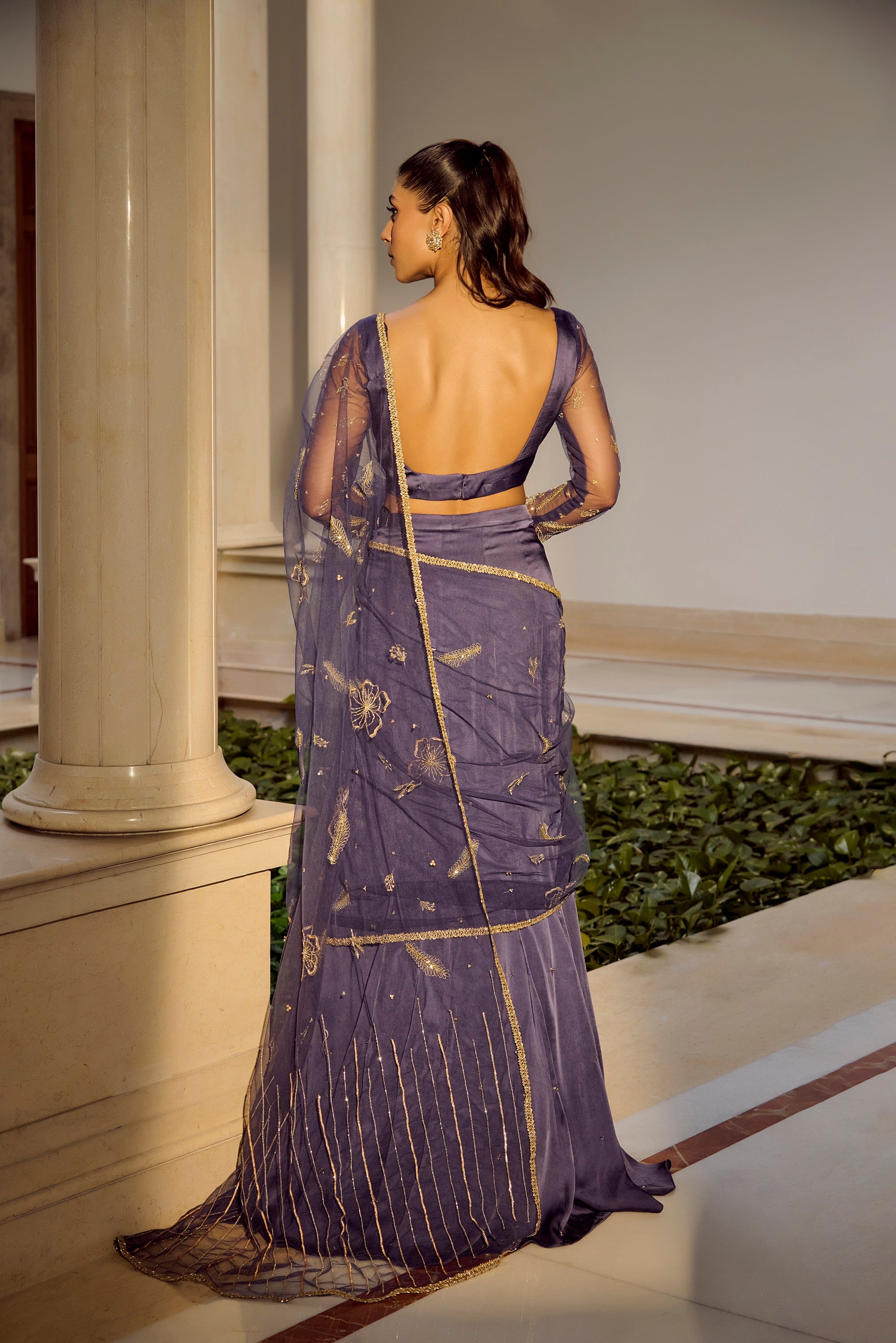 Glam Blue Saree Set - Woman in a purple saree