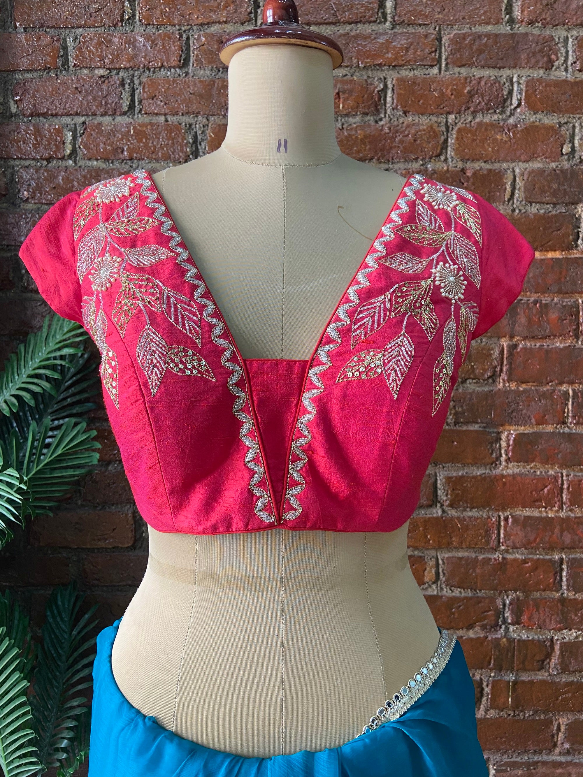 Teal Chiffon Embroidered Saree. Pink embroidered blouse