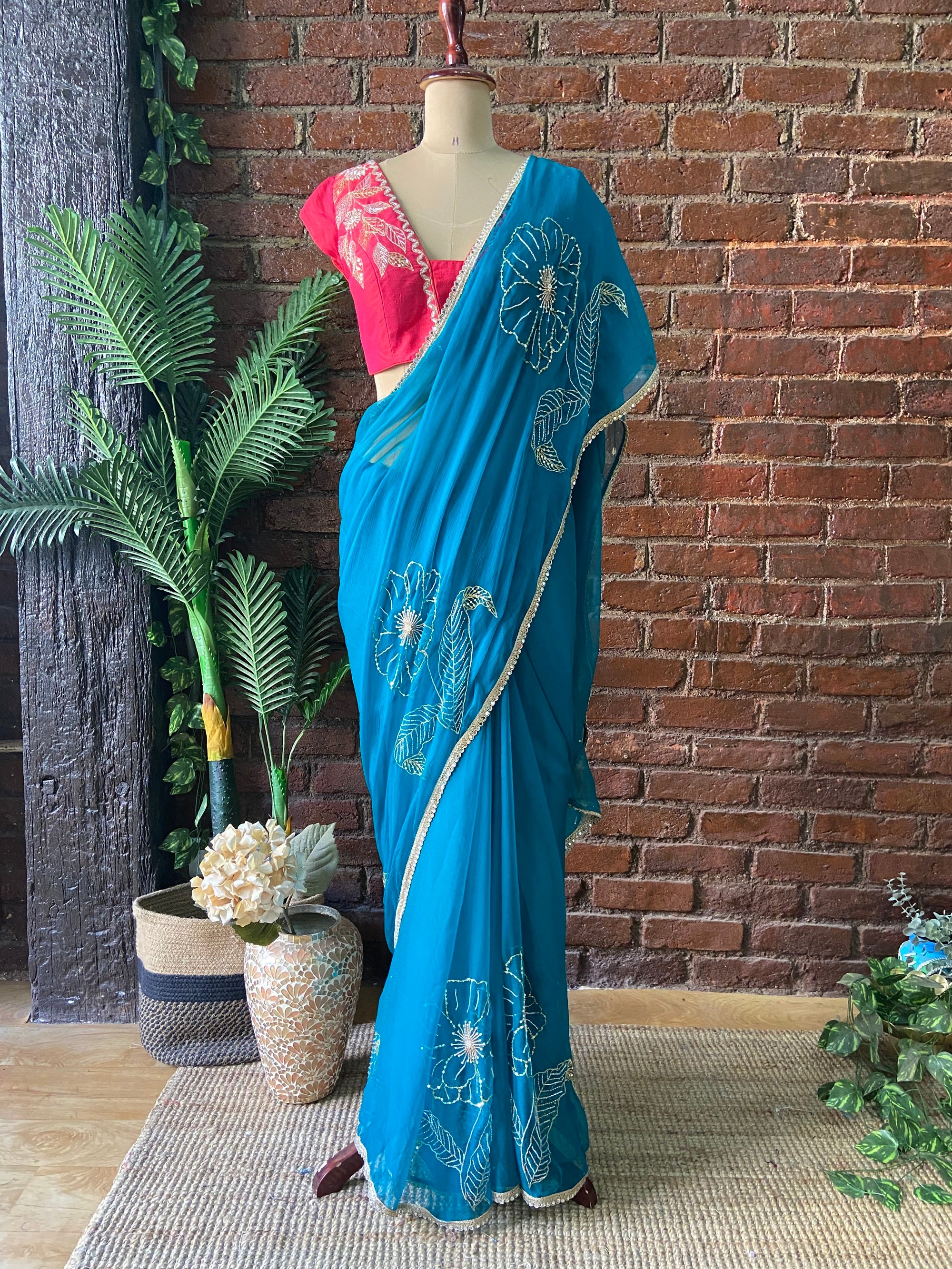 Teal Chiffon Embroidered Saree. Blue saree with floral embroidery