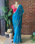 Teal Chiffon Embroidered Saree. Blue saree with floral embroidery