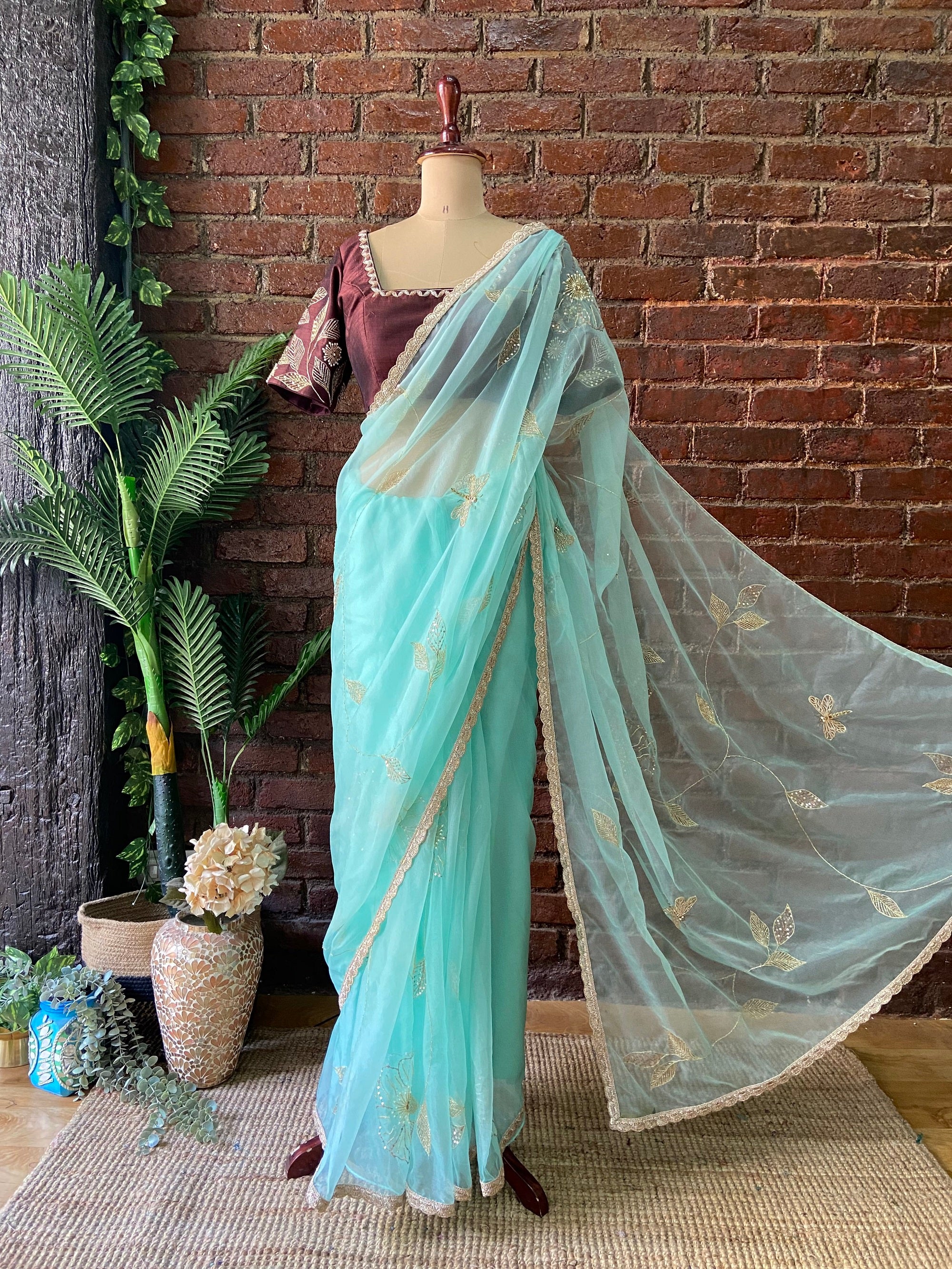 Ice Blue Organza Embroidered Saree - Light blue saree with gold border