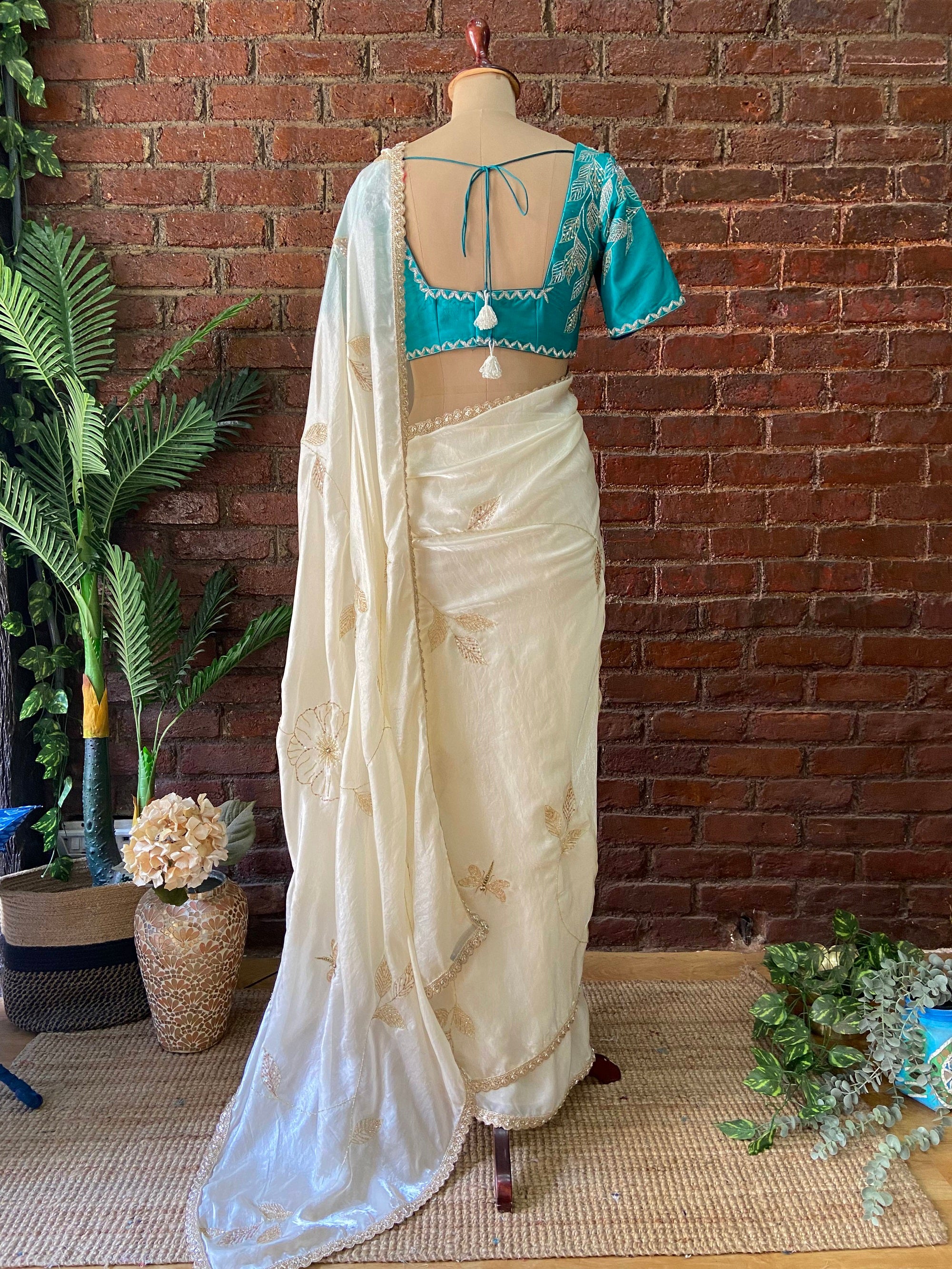 Ivory Tissue Embroidered Saree - White saree with a blue blouse