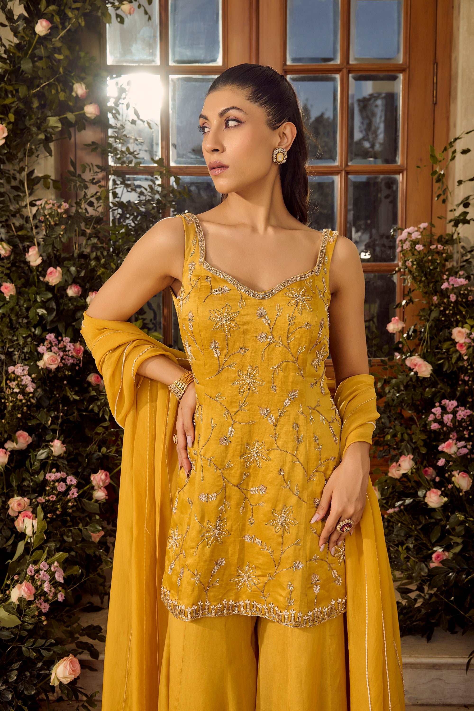 Marigold Sharara Set - Woman in a yellow traditional outfit