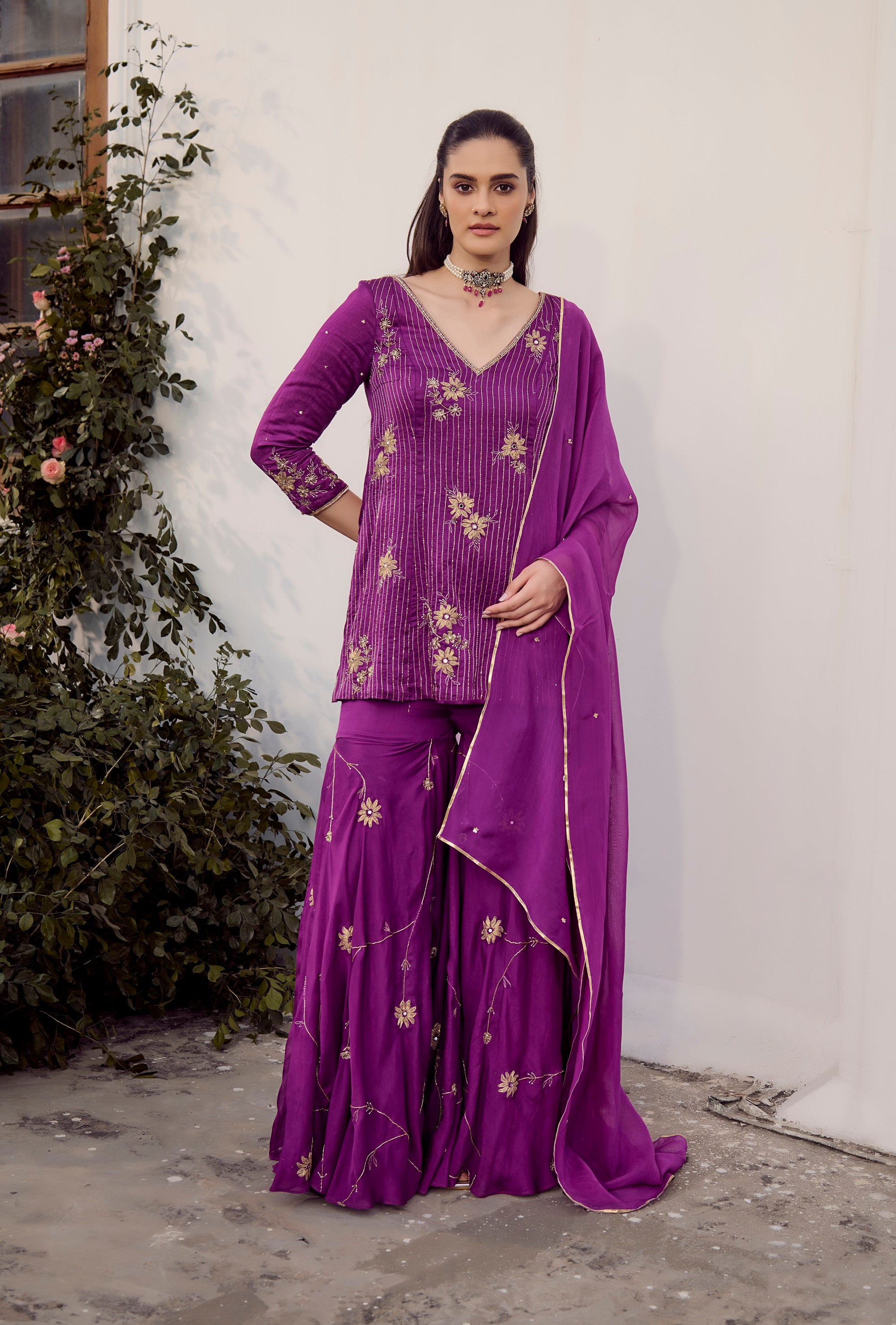 Plum Embroidered Sharara Set - Woman wearing a purple traditional Indian lehenga