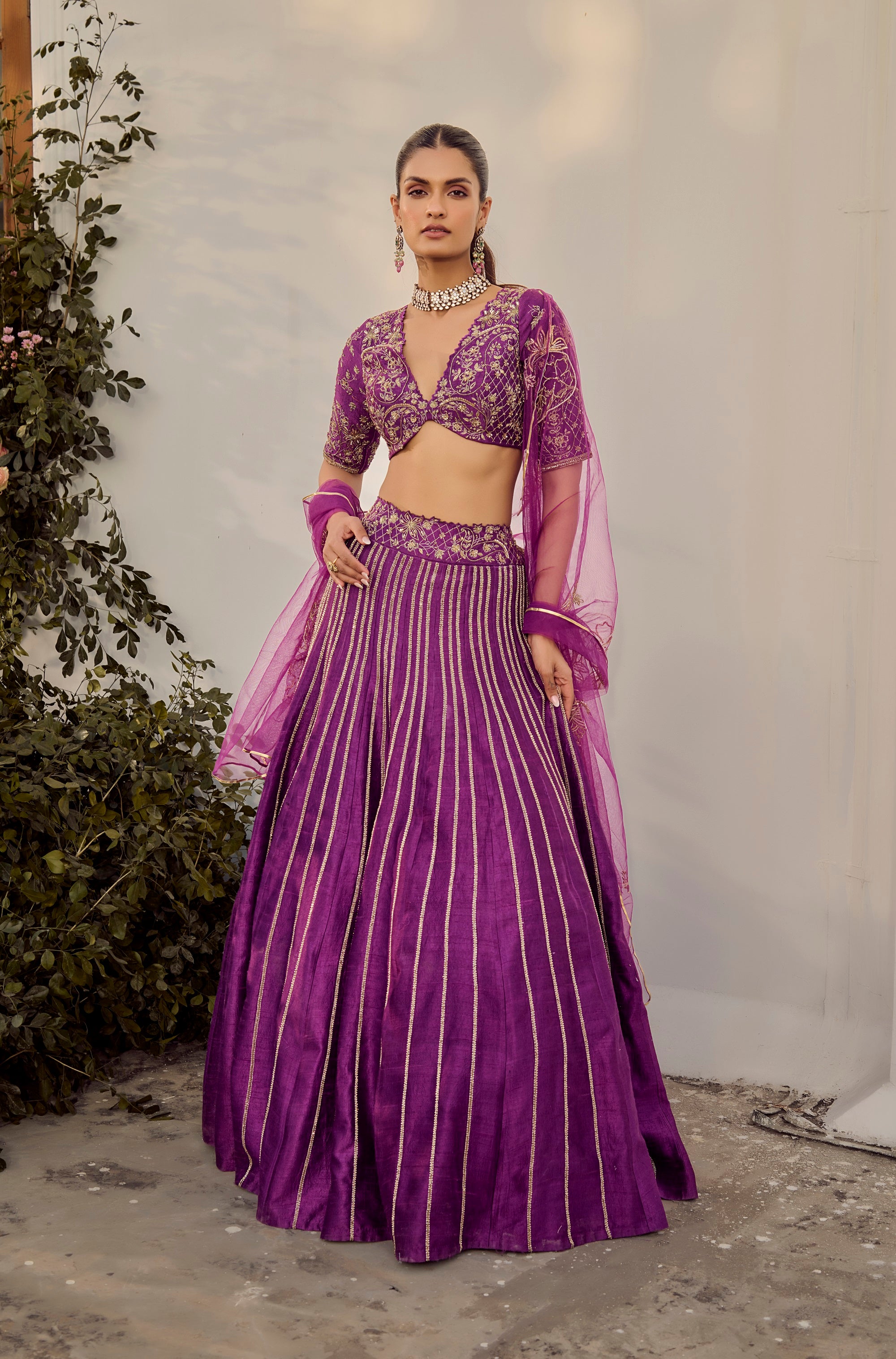 Soft Mulberry Lehenga Set. Woman in a purple traditional outfit with a matching dupatta