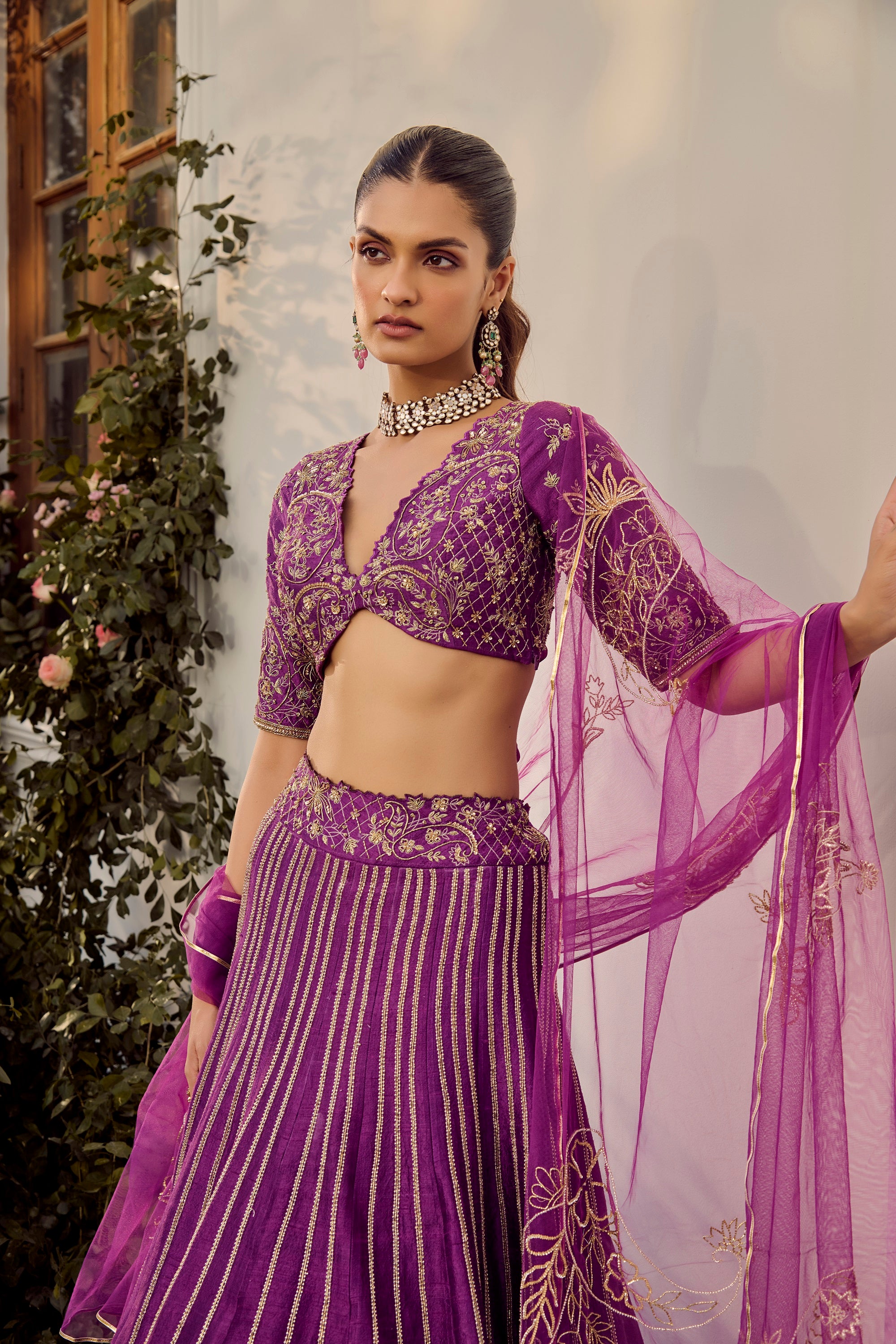 Soft Mulberry Lehenga Set. Woman in a purple traditional outfit