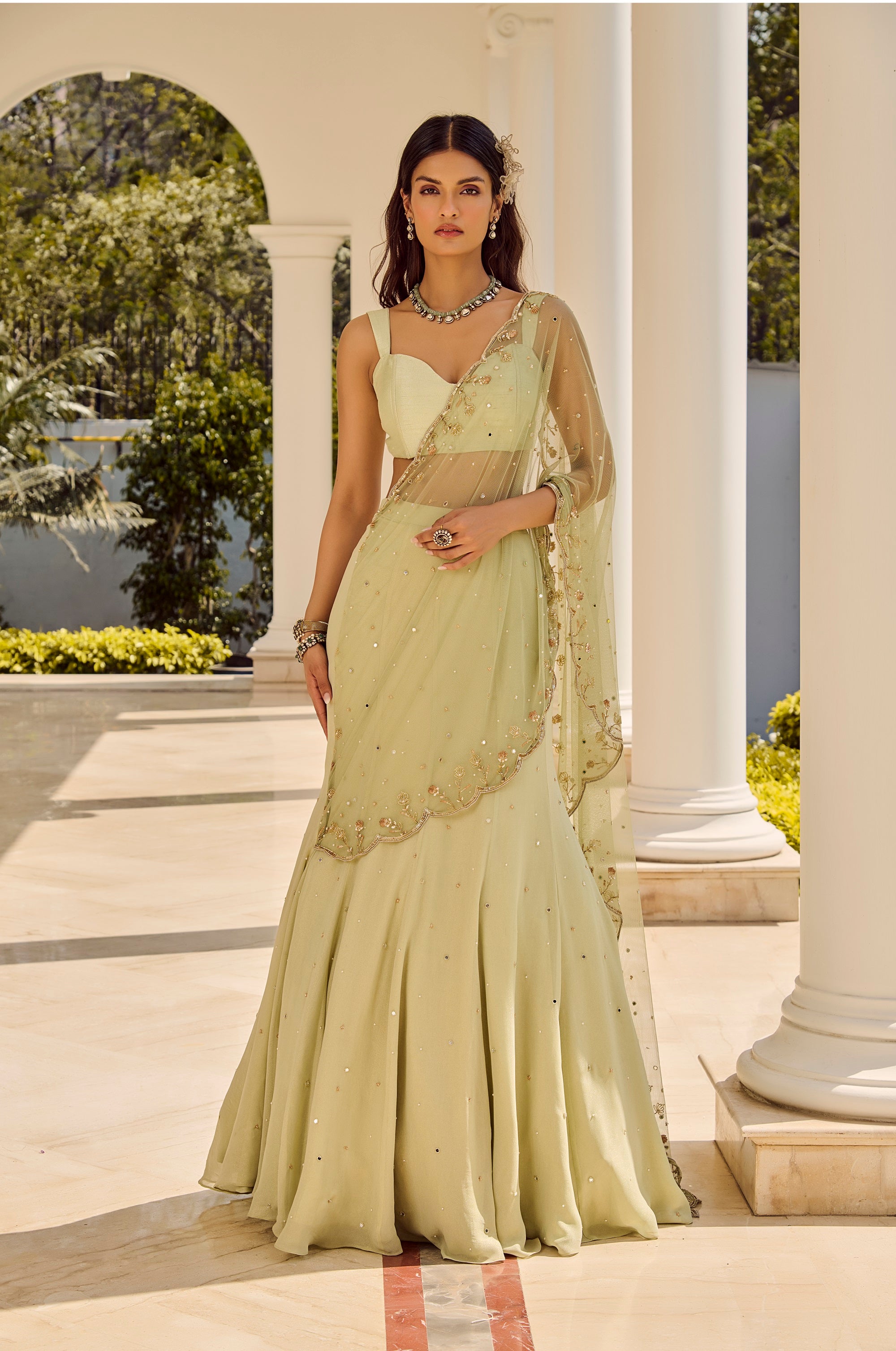 Soft Sage Saree - Woman in a light green saree