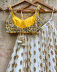 Ivory Ruffle Lehenga Set With Yellow Mirror Work Blouse - ruffle lehenga set